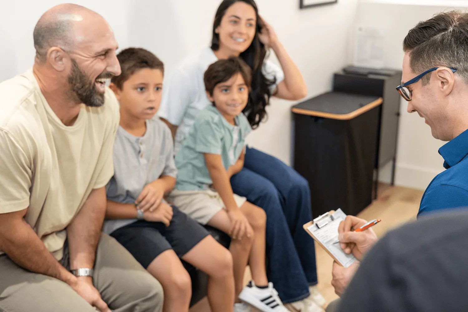 Family in the waiting room with Dr. David Ridos