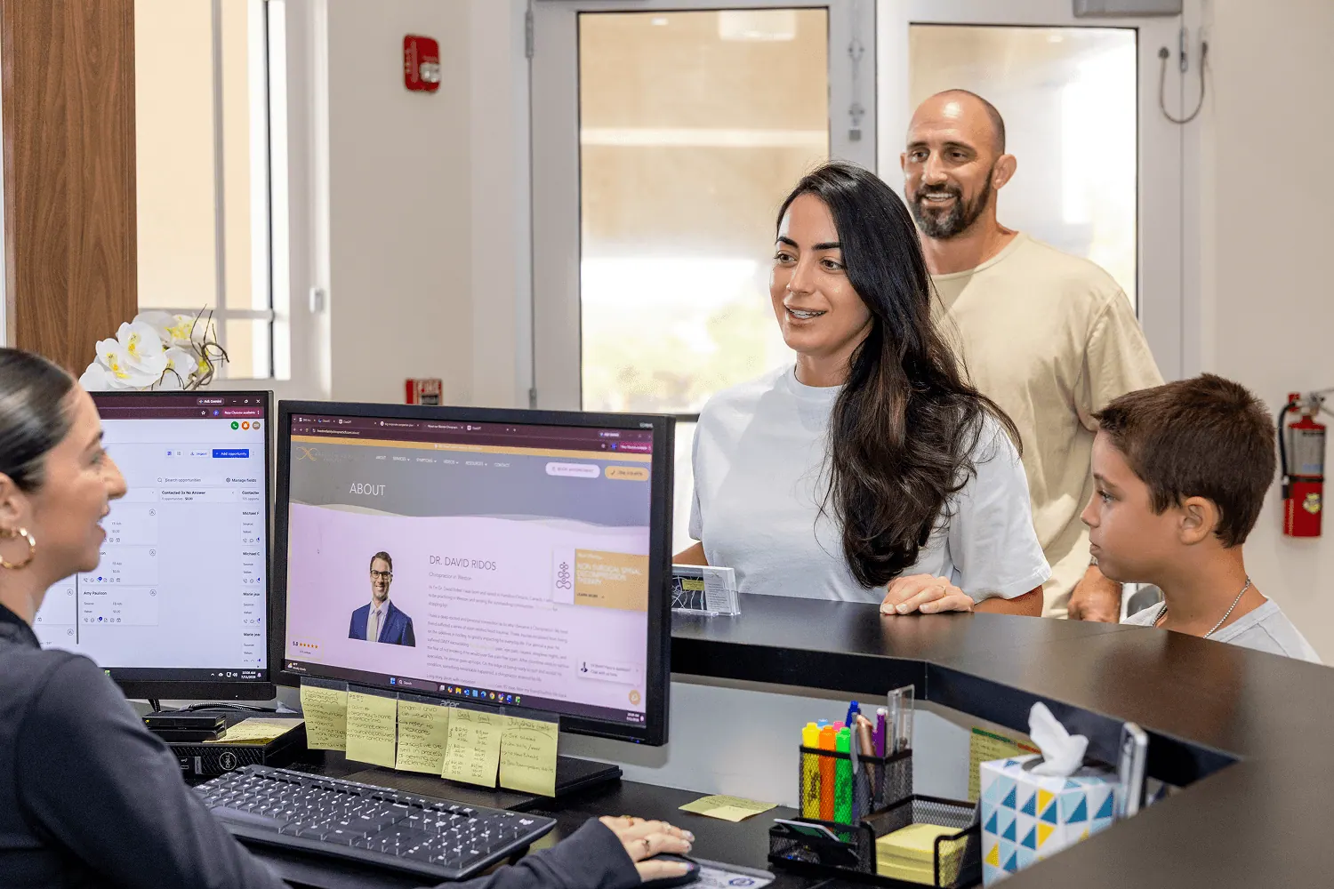 Patients checking in at the front desk