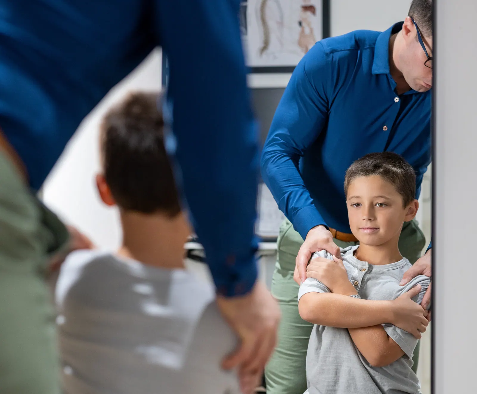 Chiropractor gently adjusting a child
